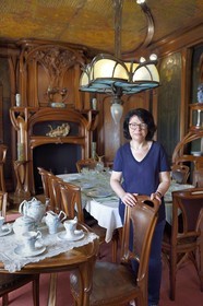 France, Meurthe-et-Moselle, Nancy, Ecole de Nancy Museum, the Art Nouveau dining room of Masson (1903-1906), furniture and woodwork by Eugène Vallin, leather panels and ceiling by Victor Prouvé, the curator Valerie Thomas