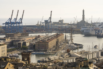 Italy, Liguria, Genoa, the Porto Antico (Old Port) seen from from the Belvedere of Castelletto, the commercial port in the background dominated by the Lanterna lighthouse