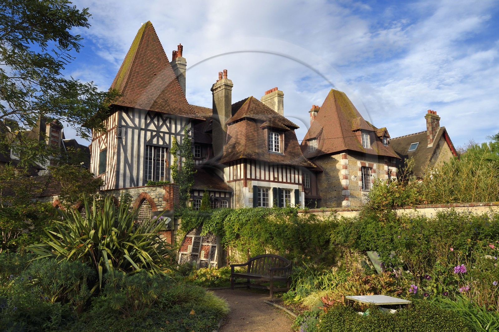 France, Calvados, Pays d'Auge, the cote Fleurie (Flowered coast), Cabourg, insect hotel in a municipal garden in front of a seaside architecture villa France, Calvados, Pays d'Auge, the cote Fleurie (Flowered coast), Cabourg, insect hotel in a municipal garden in front of a seaside architecture villa