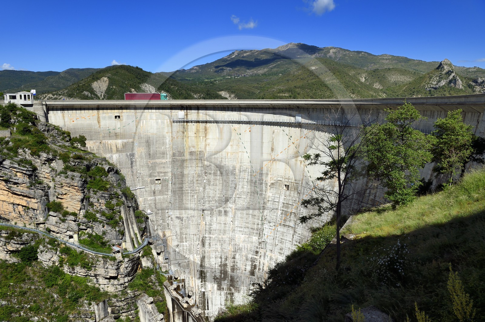 France, Alpes de Haute Provence, the lake of Castillon dam which retains the waters of the Verdon river, giant sundial on the 100 meters high wall