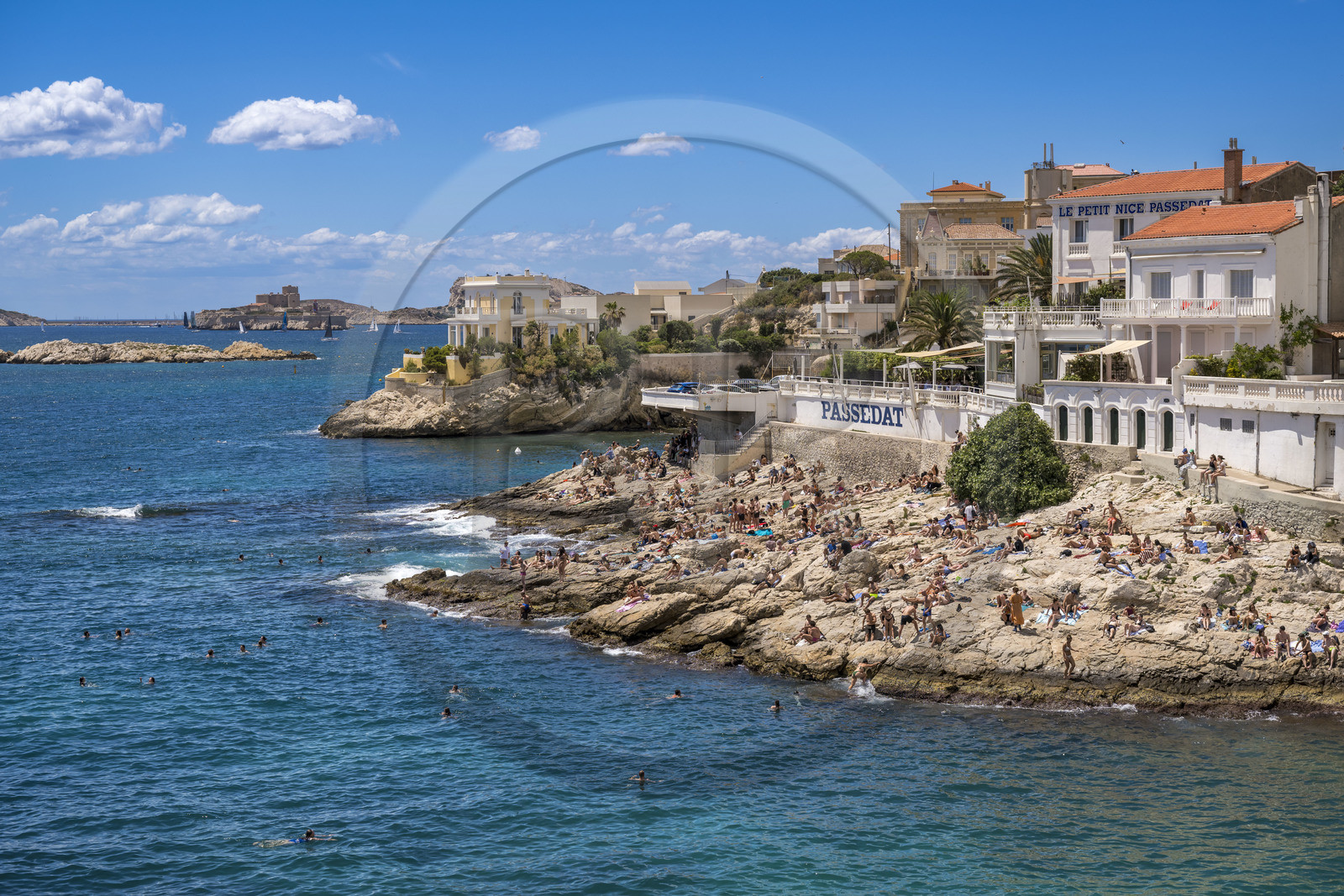 France, Bouches du Rhone, Marseille, Endoume district, the white rock beach of Petit Nice going from the cove of Fausse-monnaie to the cove of Maldormé, the Frioul Islands Archipelago with the Chateau d'If in the background