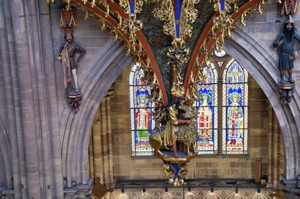France, Bas Rhin, Strasbourg, old town listed as World Heritage by UNESCO, Notre Dame Cathedral, the great organ overlooking the nave, the automaton called the Rohraffe (also Bretzelmann) on the right under the great organ, from there the faithful and the clergy were insulted during the services of the festivals of Pentecost, on the left a herald brings a trumpet to his mouth with the help of cables drawn by the organist