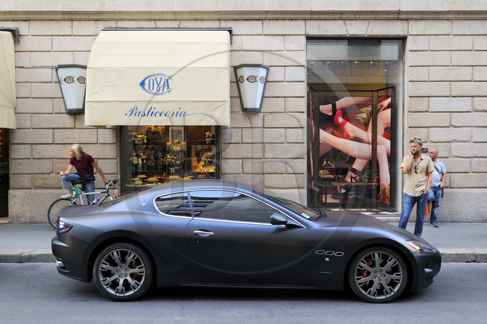 Italy, Lombardy, Milan, Quadrilatero Fashion Area, Maserati GranTurismo designed by Sergio Pininfarina in front of the historic bakery Cova founded in 1817