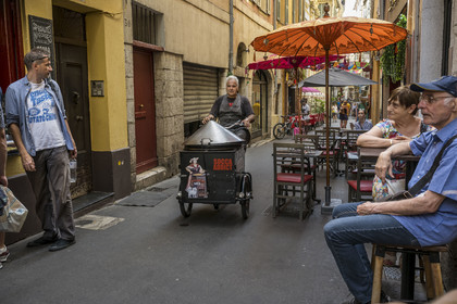 France, Alpes-Maritimes, Nice, listed as World Heritage by UNESCO, Old Nice, Robert seller and delivery of socca from Chez Theresa, pancake made from chickpea flour and a specialty of Nice