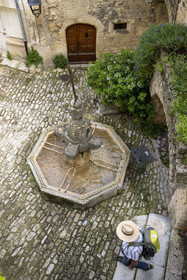 France, Vaucluse, Dentelles de Montmirail mountains, Crestet, fountain on the small square in front of the Saint Sauveur et Saint Sixte church