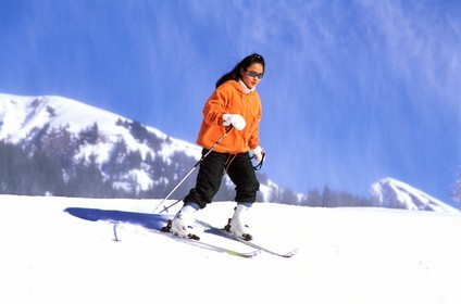 Switzerland, Bern Region (Bernese Oberland), Grindenwald is a luxury ski resort attracting people from all over the world, woman skiing