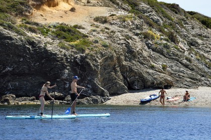 France, Var, Six Fours les Plages, Ile des Embiez, cape Saint Pierre, Freestyle windsurfing champion Adrien Bosson on a paddle boarding excursion