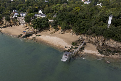 France, Loire Atlantique, Estuaire de la Loire, Saint Nazaire, the Feu de Porcé (lighthouse) along the GR 34 long-distance trail, alignment lights which serve to mark the maritime channel allowing entry into the Loire estuary and  traditional carrelet (fishing shack) on the beach