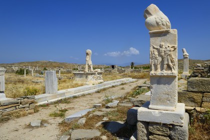Greece, Cyclades islands, Delos, listed as World Heritage by UNESCO, the archaeological site of Delos, Apollo's Sanctuary, the most ancient city of the Aegean Sea, column with phallus at the Stoivadeion